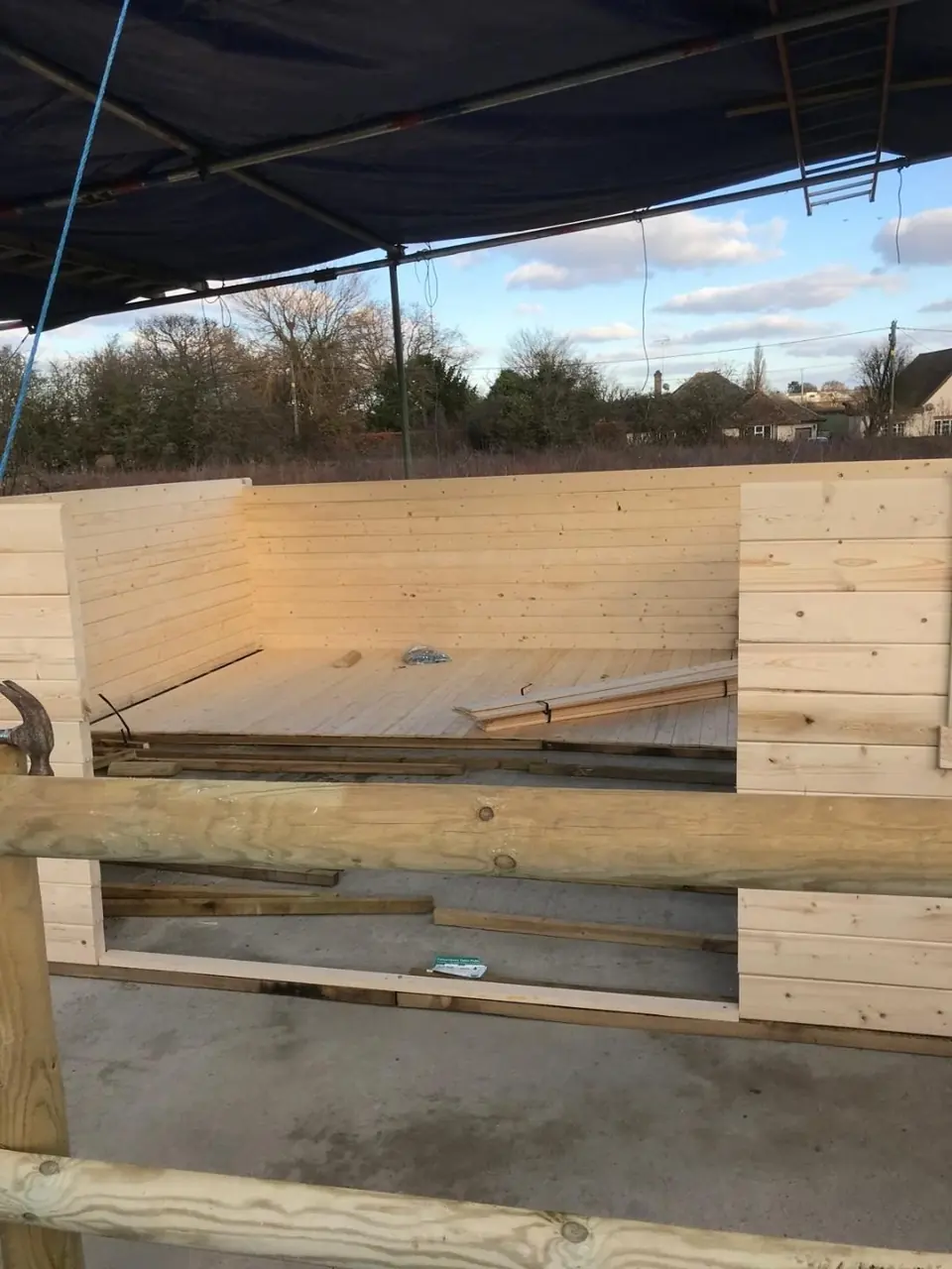 Build-progress photograph showing the enclosed cabin and recognisable front openings