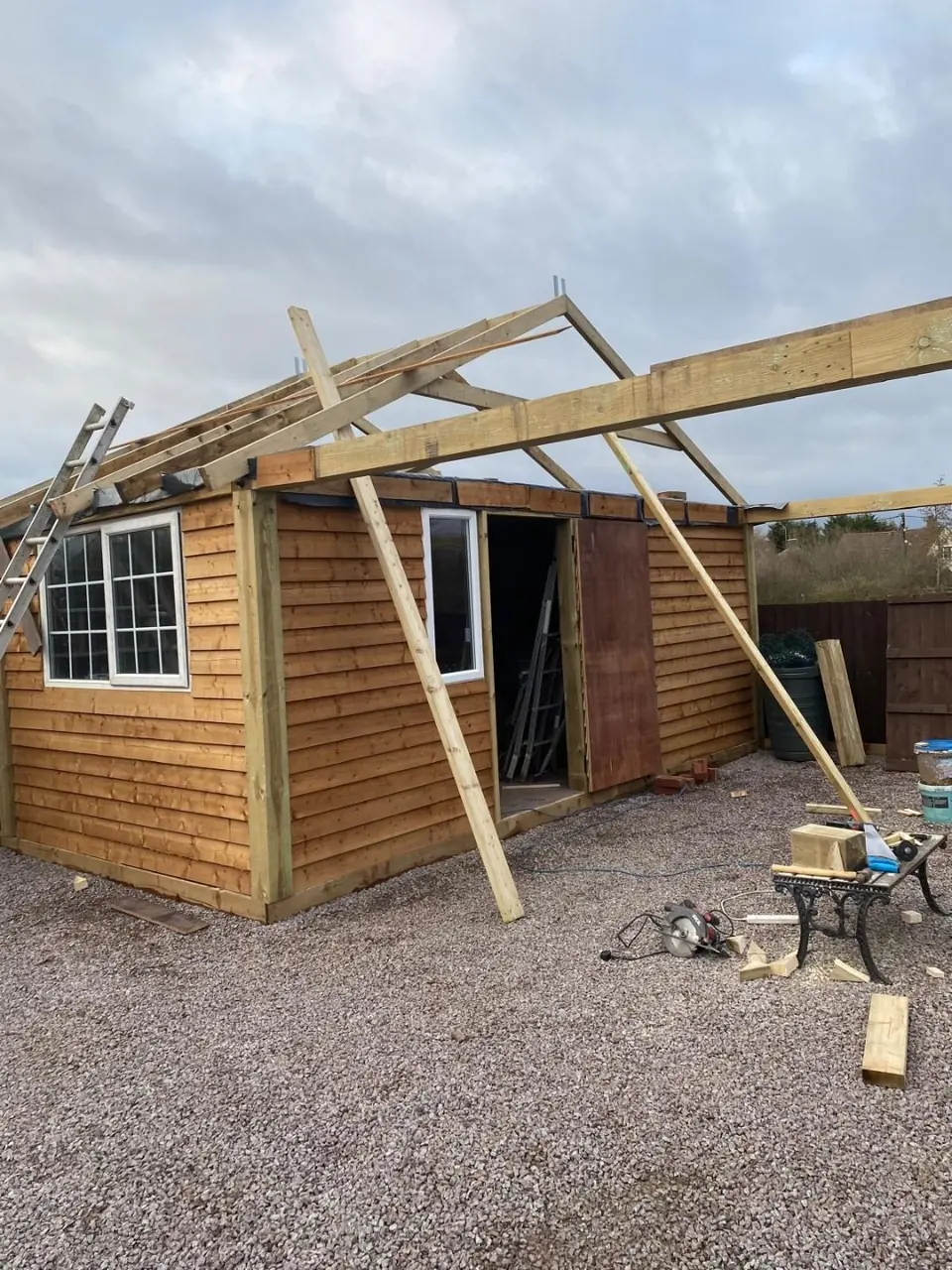 Earliest recorded view with workshop cladding and roof framing under way
