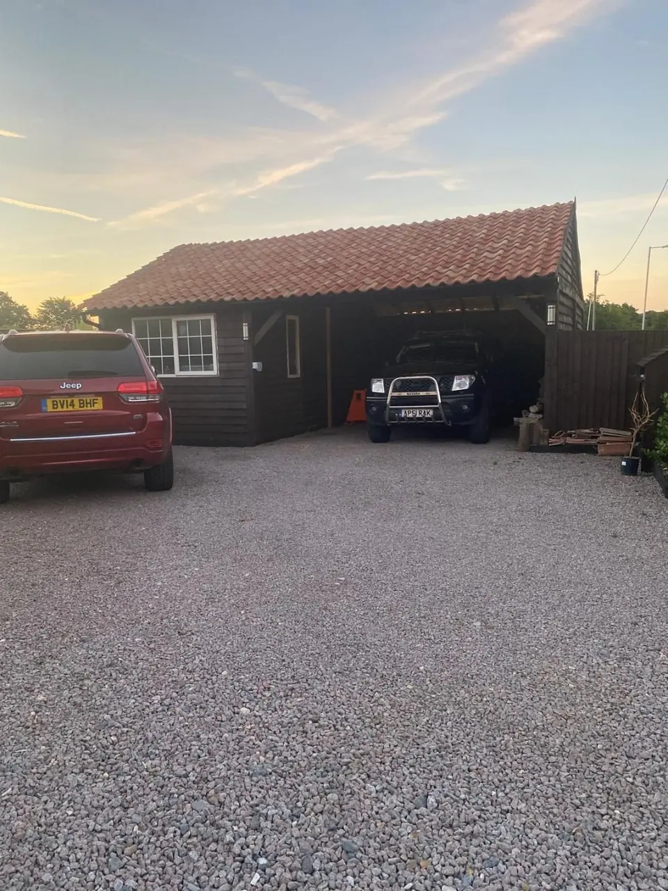 Completed timber car port and workshop with a clay-tiled roof