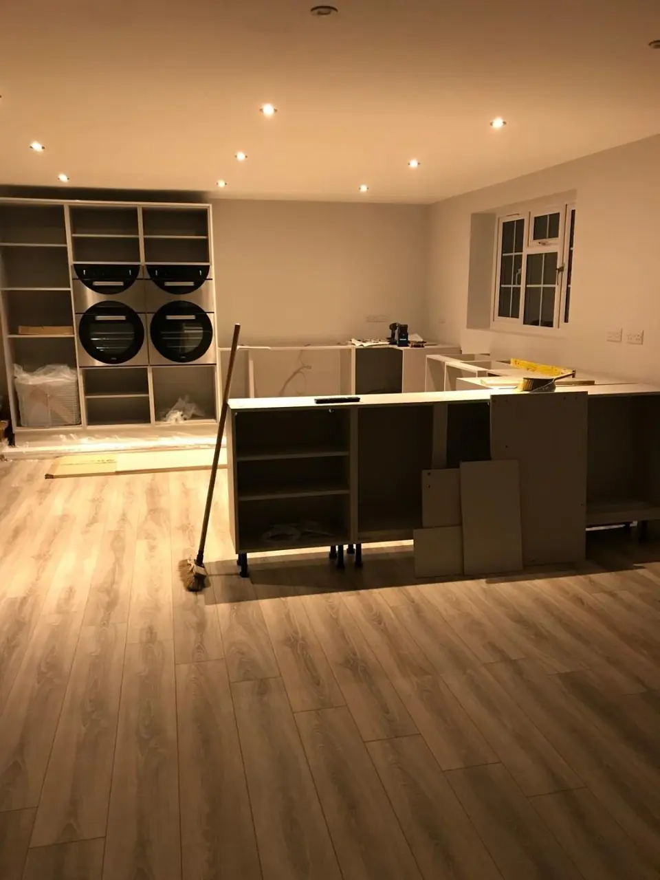 Cabinet carcasses and the appliance bank being installed