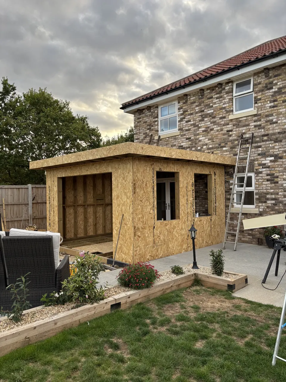 Side wall of the extension with timber sheathing being installed