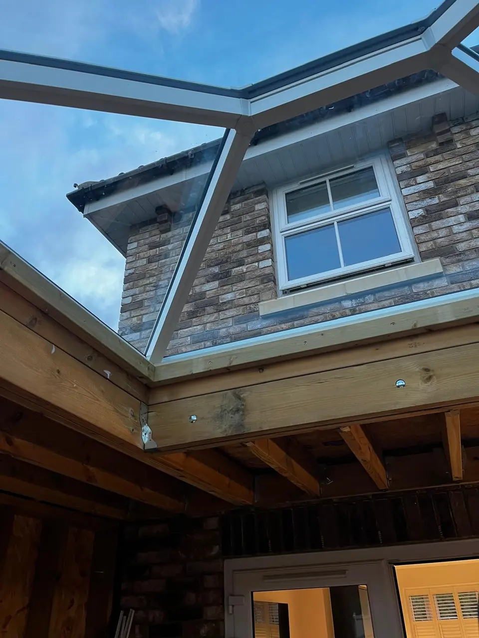 View up through the roof lantern above the exposed timber roof structure