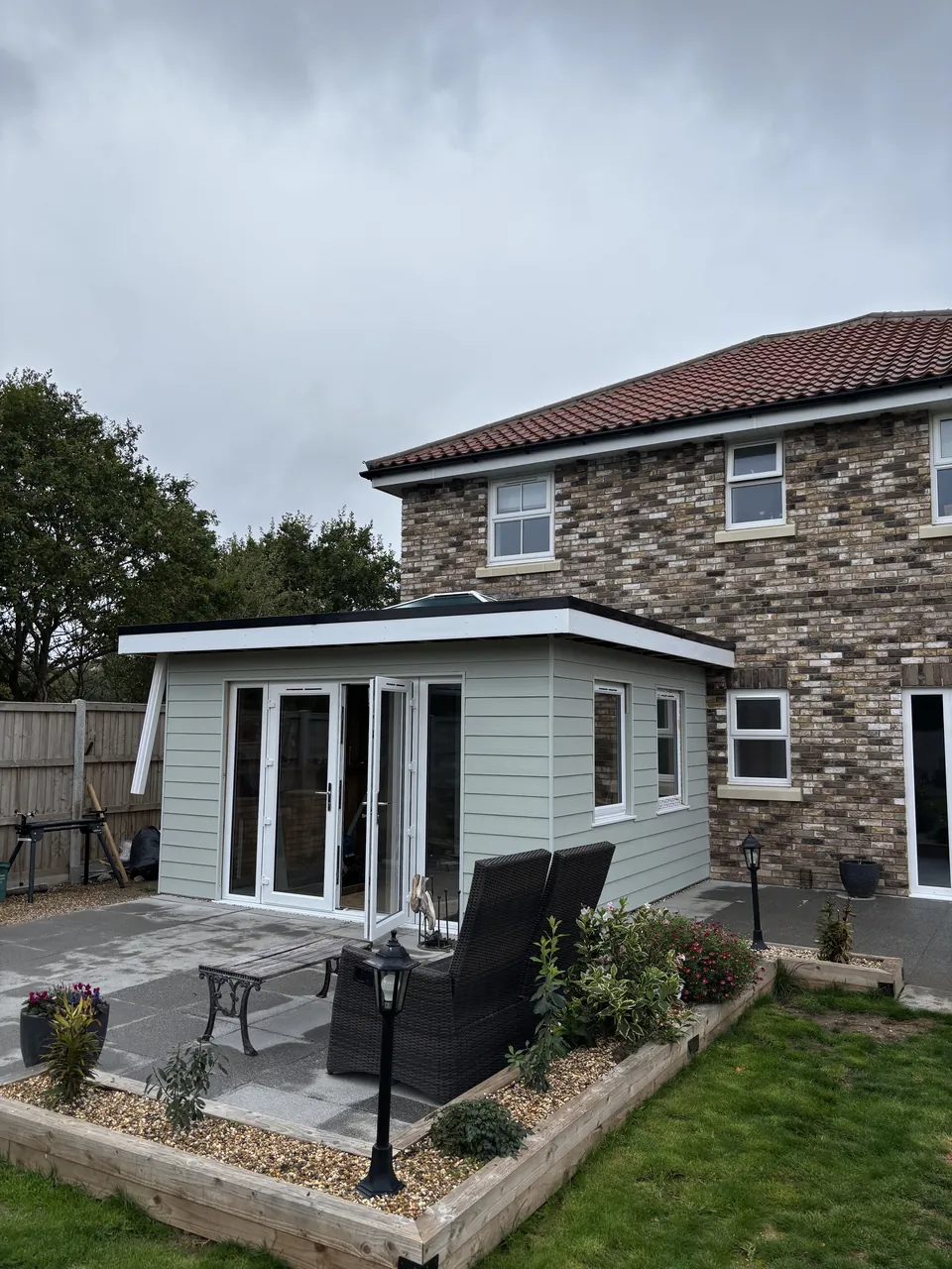 Front of the clad extension with its glazed doors and windows