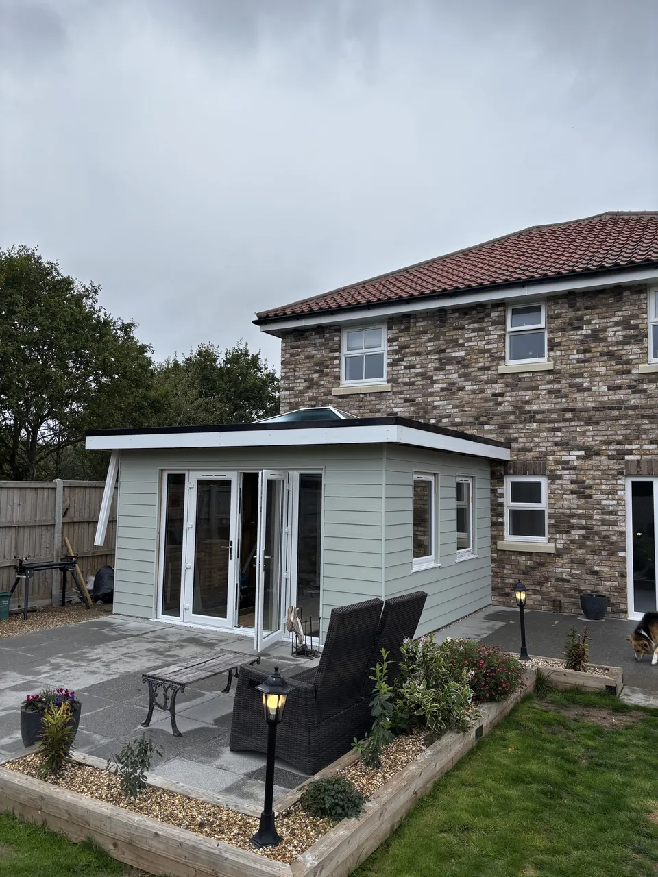The clad extension from the patio side, with the house behind